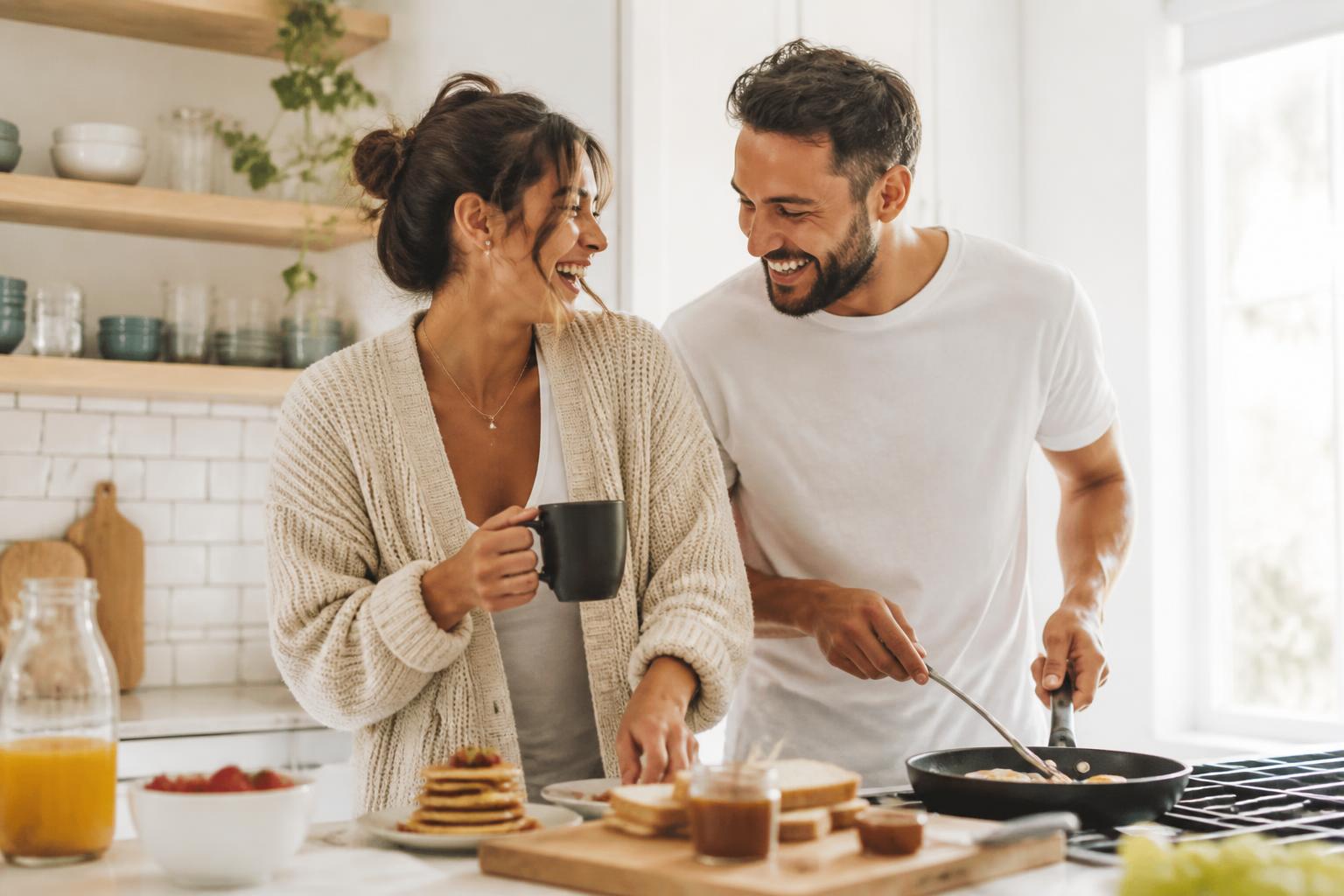 Couple enjoying a weekend morning together in the kitchen